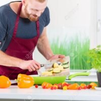 Man preparing food for cooking in kitchen