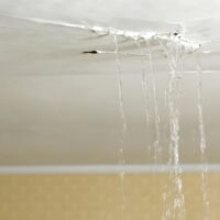 ceiling-leaking-water-into-living-room-royalty-free-image-1692809233