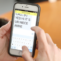 hand-holding-smartphone-with-text-message-showing